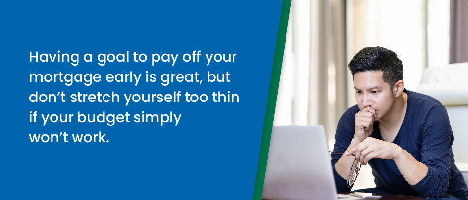 Having a goal to pay off your mortgage early is great, but don't stretch yourself too thin if your budget simply won't work - Image of a man staring at a computer screen contemplating something